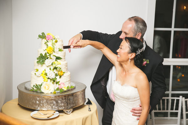 Bride and Groom Cut Floral Wedding Cake